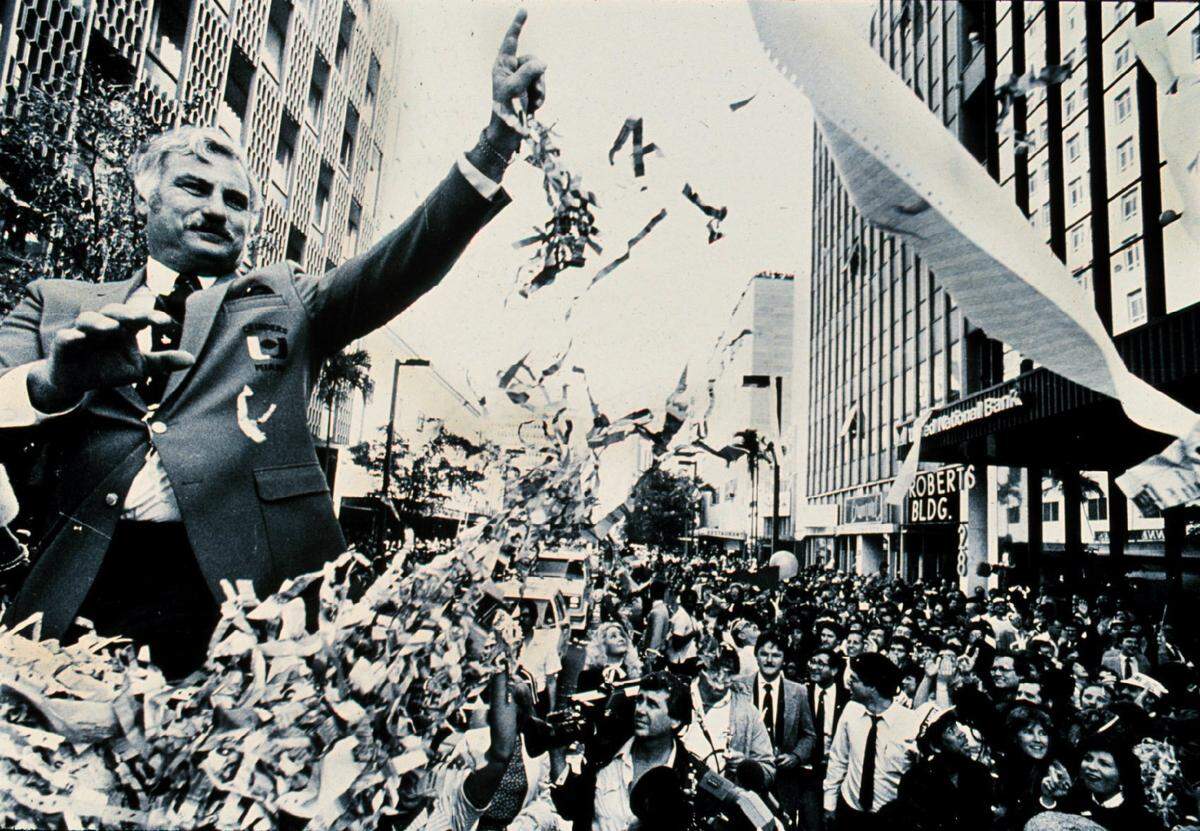 FOR SPORTS MILLENIUM PROJECT 12/2/99 PHOTO BY JOE RIMKUS JR MHS....Howard Scnellenberger(Check Spelling) in a ticker tape parade down Flagler street after winning National Championship.