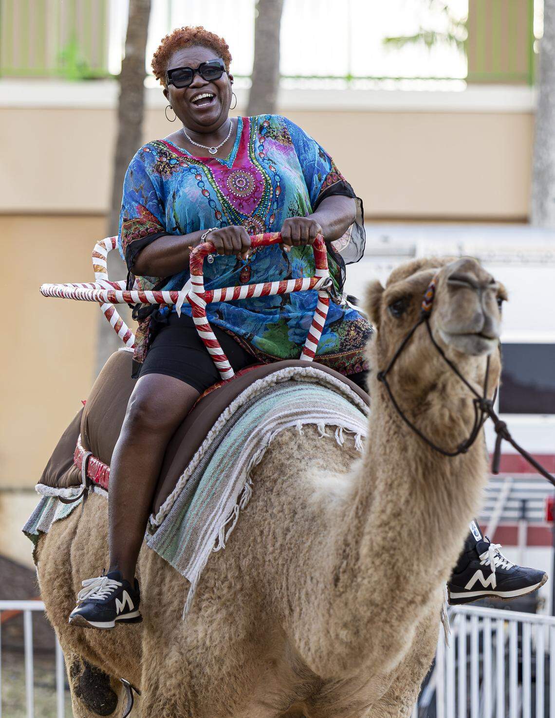 Michelle Bonton-Walkins reacts as she rides a camel during the opening day of the 74th annual Miami-Dade County Youth Fair on Thursday, March 12, 2026, in Miami, Fla.
