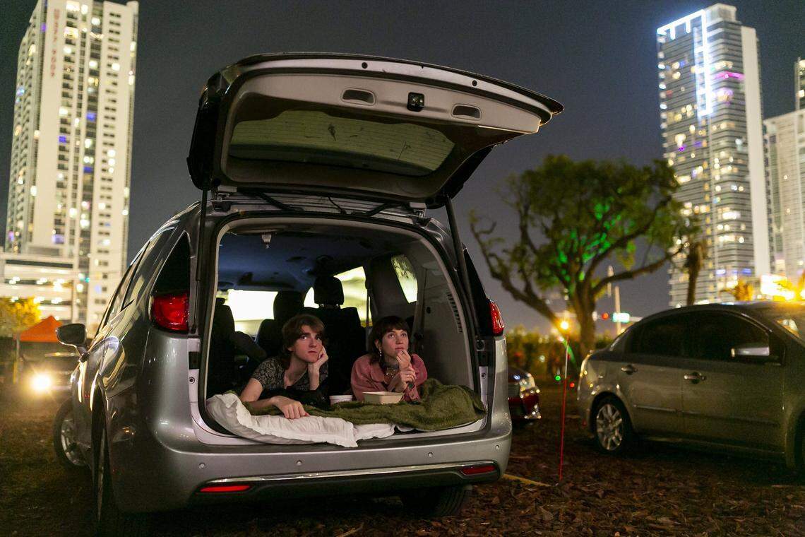 Flipp Posner, left, and Chandler Jaffe watch Suspiria at the Nite Owl Drive-In theater in downtown Miami, Florida on Friday, January 22, 2021.
