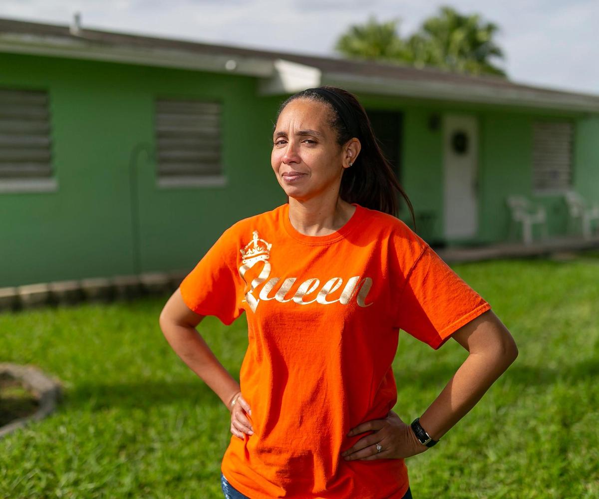Cheri Dotson, 44, who has multiple sclerosis, stands outside of her home in MiamiÕs Richmond West neighborhood on Friday, December 4, 2020.