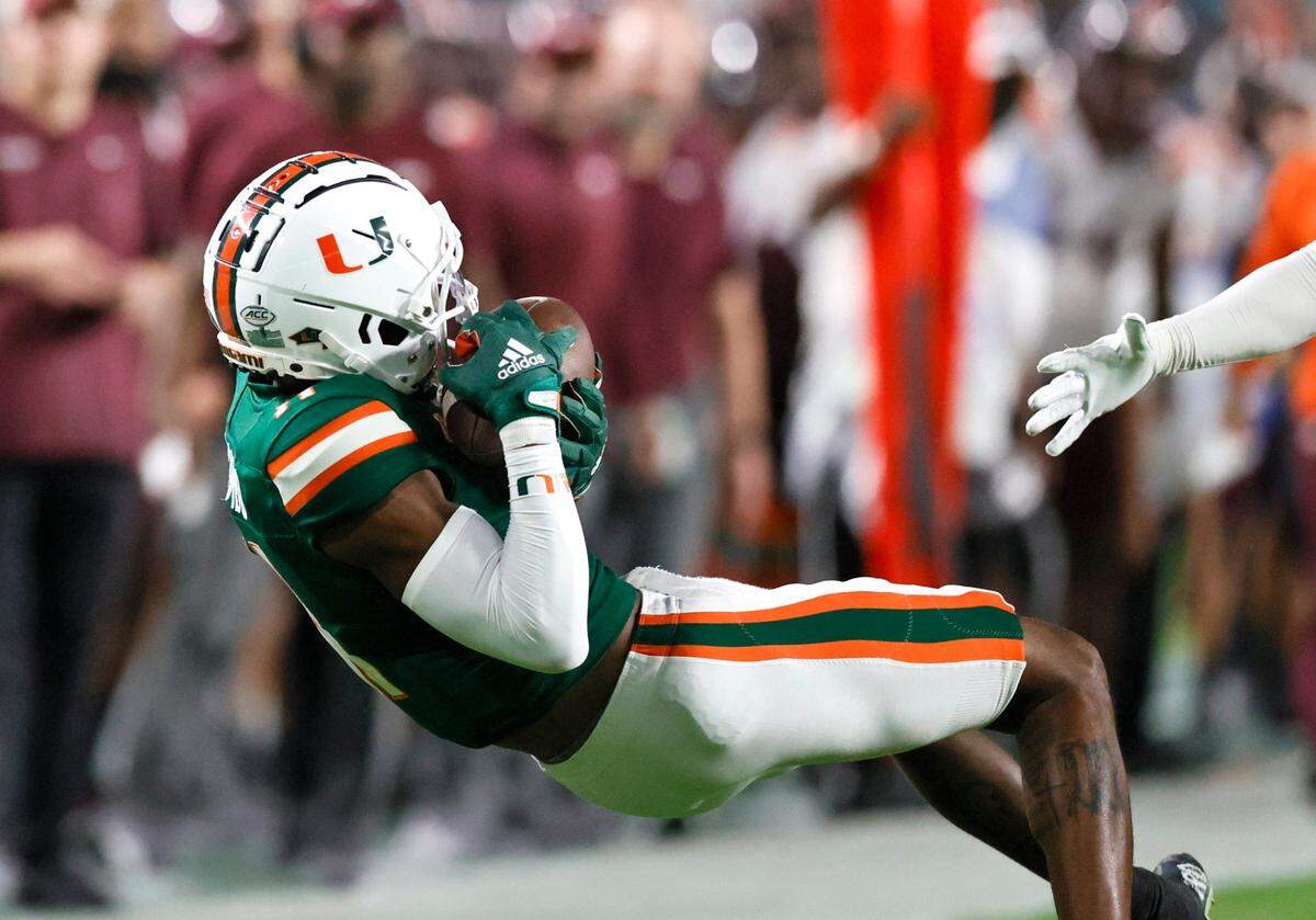 Miami Hurricanes wide receiver Charleston Rambo (11) catches a pass during the first quarter of their ACC football game against the Virginia Tech Hockies at Hard Rock Stadium on Saturday, November 20, 2021 in Miami Gardens, Florida.