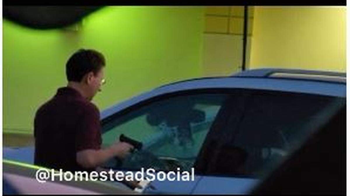 A still from video posted to the @HomesteadSocial Instagram account of the encounter between a gun-holding Alexander Arrington and police officers that ended with Arrington’s death Saturday night.