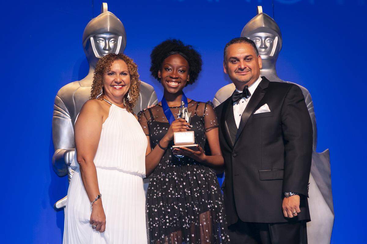 The Broward Silver Knight winner in art, Thea Gay from Coral Glades High, receives her award from Alex Mena, sports editor of the Miami Herald and el Nuevo Herald, and Nancy San Martin, managing editor of el Nuevo Herald, during the 61st Silver Knight award ceremony at the James L. Knight Center on Thursday, May 16, 2019.