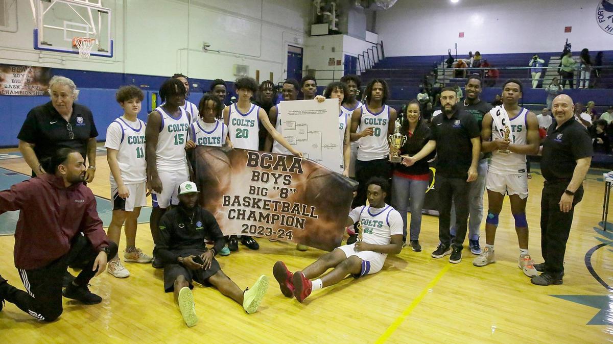 The Coral Springs boys’ basketball team poses with the trophy after winning the BCAA Big 8 basketball final game against South Plantation on Saturday, January 27, 2024 at Fort Lauderdale HS in Fort Lauderdale.