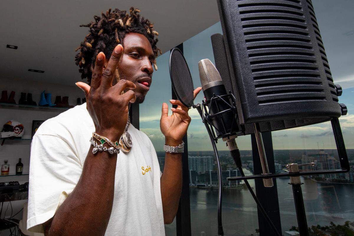 Carlos St. John Phillips, known professionally as SAINt JHN, a Guyanese-American rapper, singer and songwriter raps in his living room/recording studio at his home in Sunny Isles Beach, Florida, on Monday, August 2, 2021.