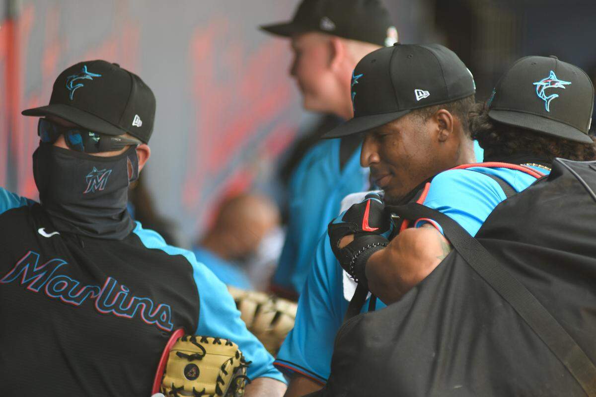Miami Marlins pitcher Sixto Sanchez in the dugout prior to facing the Houston Astros in a spring training game on Monday, March 15, 2021, at the Ballpark of the Palm Beaches in West Palm Beach, Florida.