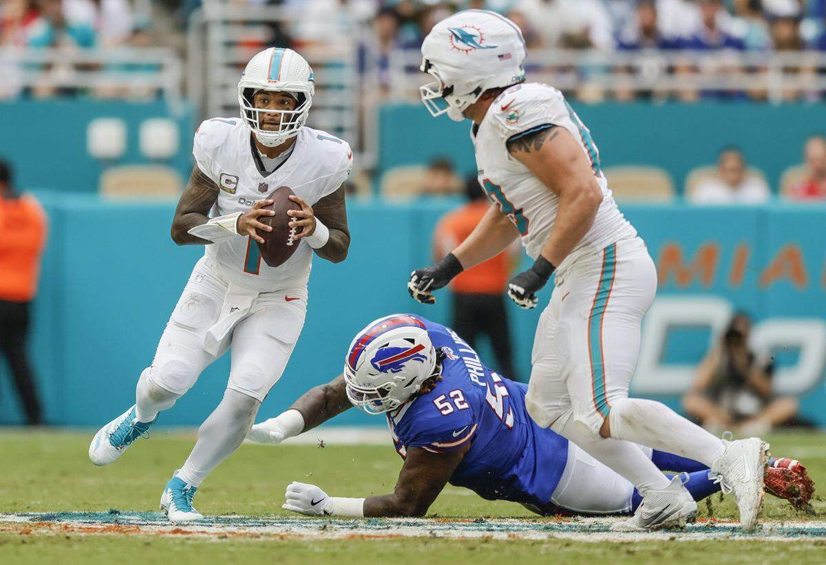 Miami Dolphins quarterback Tua Tagovailoa (1) looks to pass in the second half of an NFL football game against the Buffalo Bills at Hard Rock Stadium in Miami Gardens, Florida on Sunday, November 9, 2025.