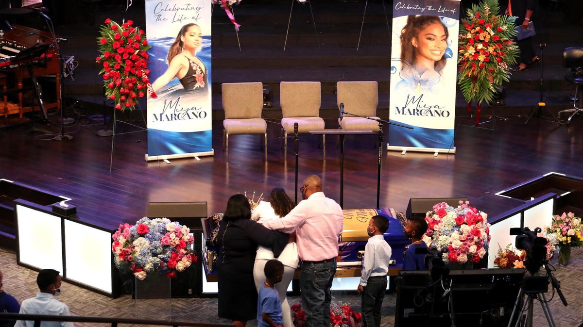 A woman cries over the casket of Miya Marcano, 19, during a Celebration of Life for Marcano at the Cooper City Church of God in Cooper City on Wednesday, Oct. 13, 2021. Marcano’s body was found near the Tymber Skan apartment complex in Orlando.
