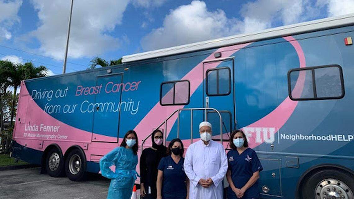 Seema Azim, second from left, stands with Imam Abdul Hamid Samra and the crew of the mobile mammography center at the Islamic Center of Greater Miami