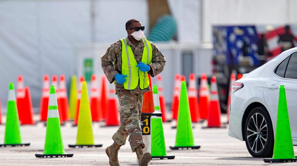 Included in Gov. Ron DeSantis’ $4.1 billion plan for federal stimulus money coming to Florida is enough to pay for 450 more National Guard troops. In this photo, a member of the Florida National Guard troop is on duty at the COVID-19 drive-thru testing center at Hard Rock Stadium in Miami Gardens on Wednesday, October 28, 2020.
