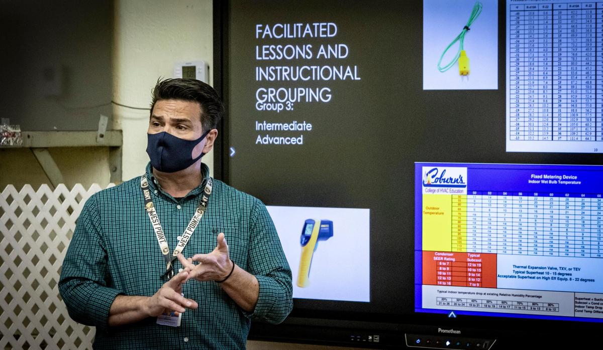 Derek Bostick, a Teacher of the Year finalist, instructs his students at South Dade Technical College.