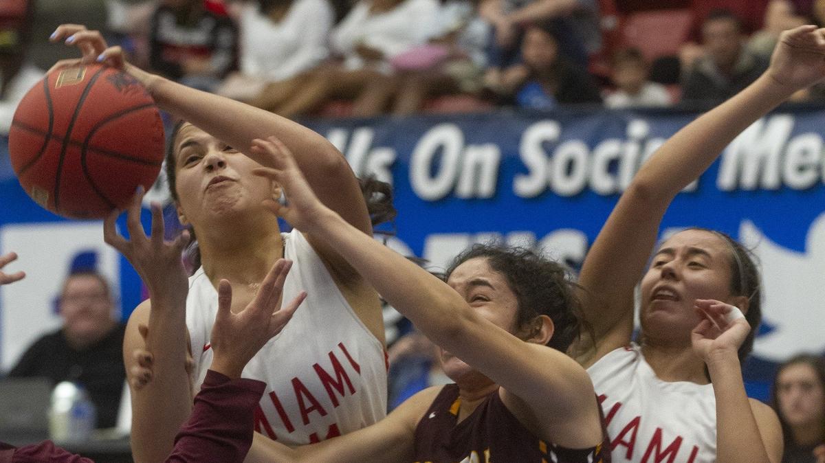 Miami Christian’s Shella Rodriguez (11) battles for rebound with Bayshore Christian’s Domenica Zamora (4) during the first half of their FHSAA Girls 2-A Semifinal game at The RP Funding Center in Lakeland Monday. Miami Christian lost 53-50. February 25, 2019.