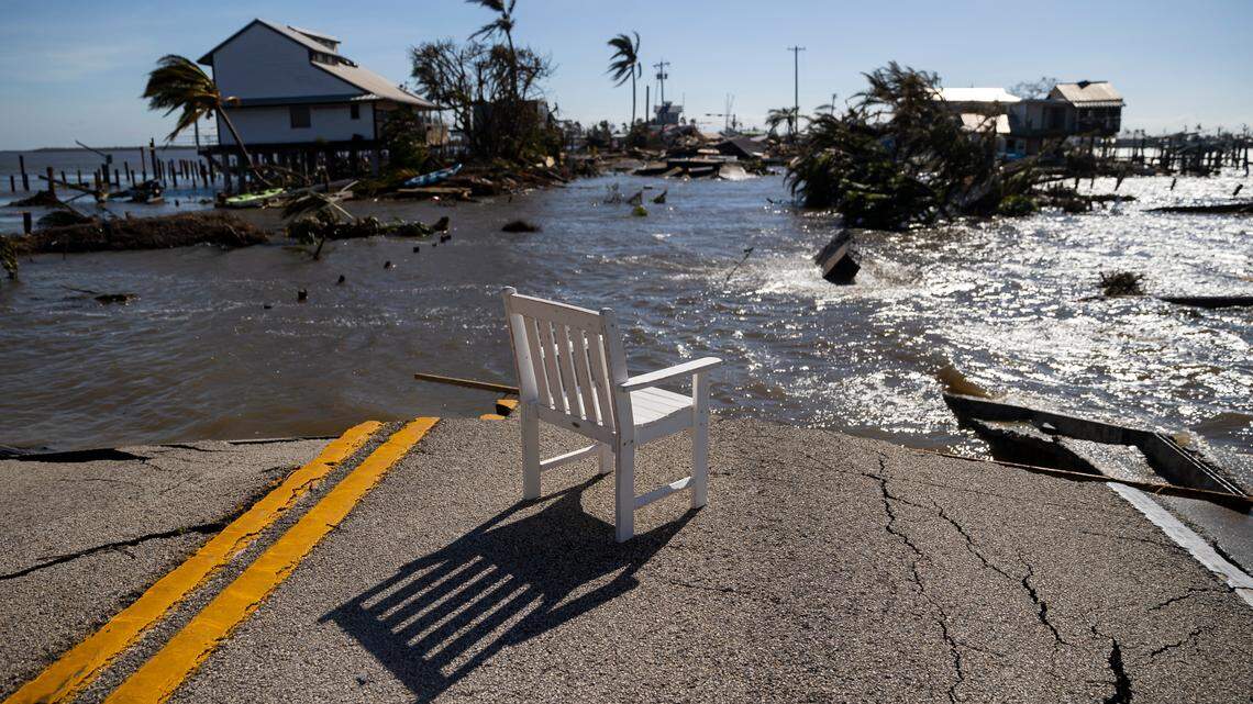 Gulf water flows through a broken section of Pine Island Road on Thursday, Sept. 29, 2022, in Matlacha, Fla. Hurricane Ian made landfall on the coast of South West Florida as a category 4 storm Wednesday afternoon leaving areas affected with flooded streets, downed trees and scattered debris.