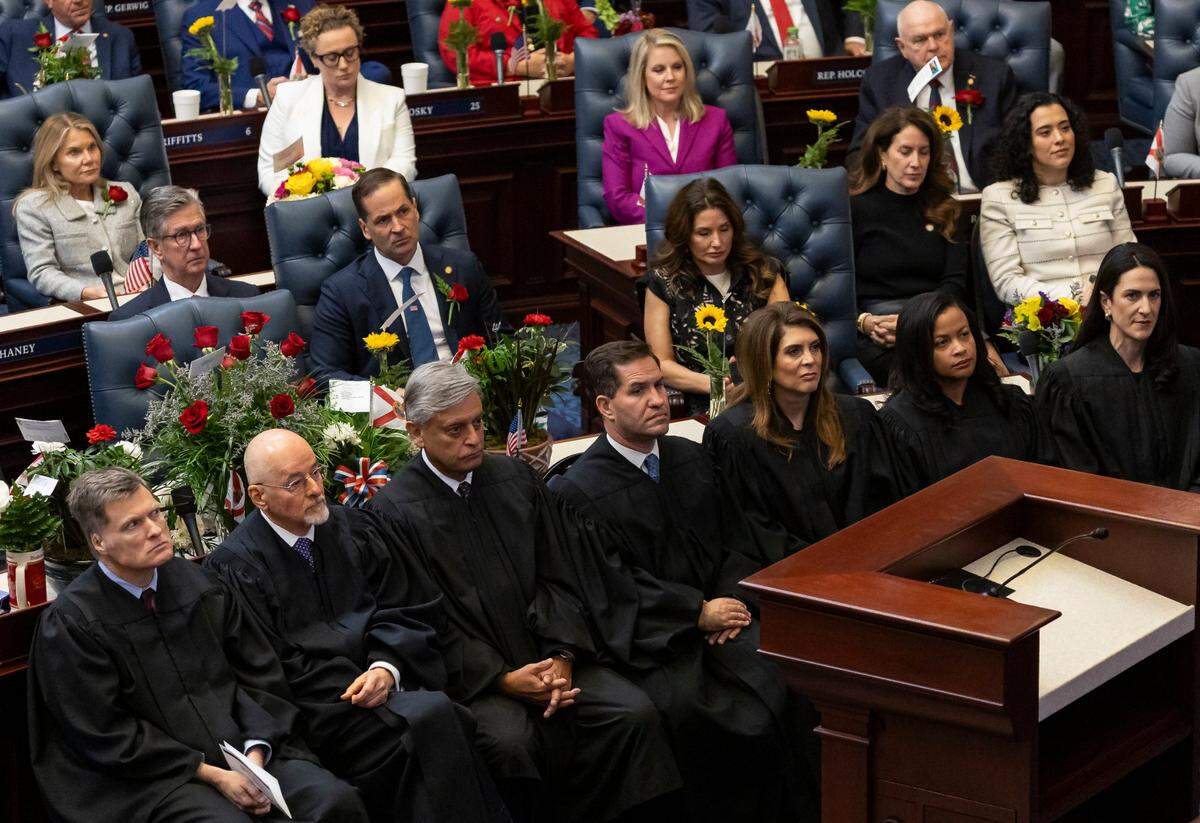 From left to right: Florida Supreme Court Justices Chief Justice Carlos G. Muñiz, Justice Charles T. Canady, Justice Jorge Labarga, Justice John D. Couriel, Justice Jamie R. Grosshans, Justice Renatha Francis and Justice Meredith L. Sasso listen to Florida Governor Ron DeSantis deliver his State of the State address during the first day of the legislative session at the Florida State Capitol on Tuesday, March 4, 2025, in Tallahassee, Fla.