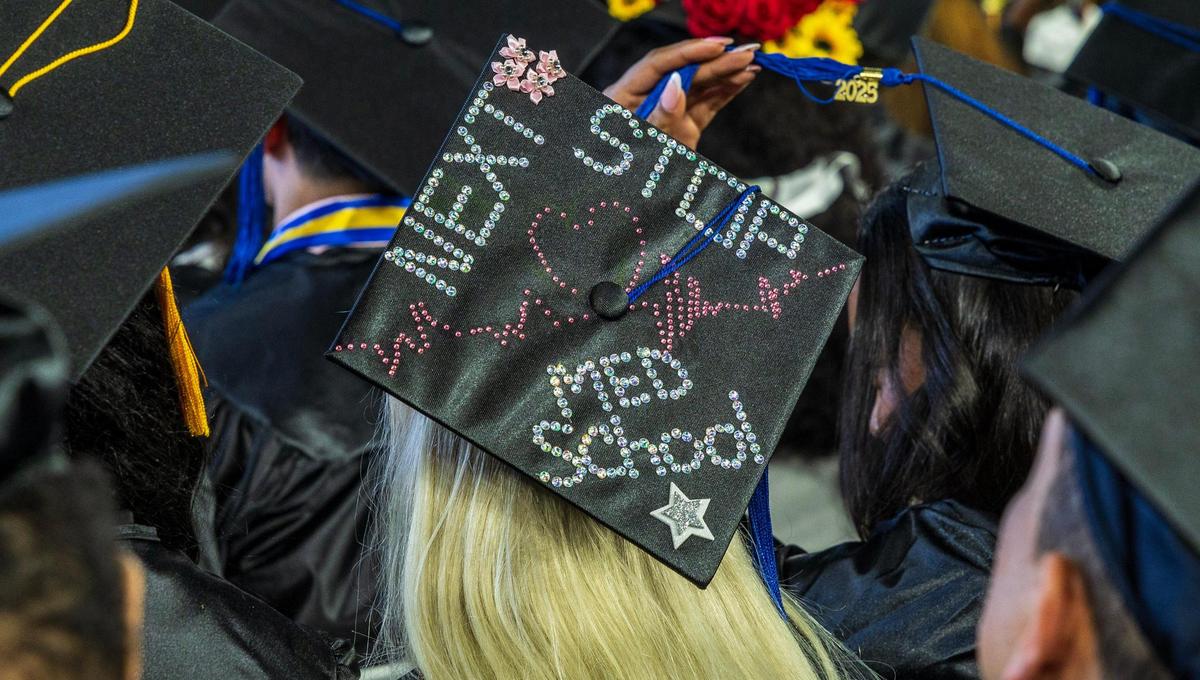 Messages on graduating students’ mortarboards during Miami Dade College’s North, Hialeah and West Campuses 2025 commencement ceremonies at LoanDepot Park, in Miami on Saturday, April 26, 2025.