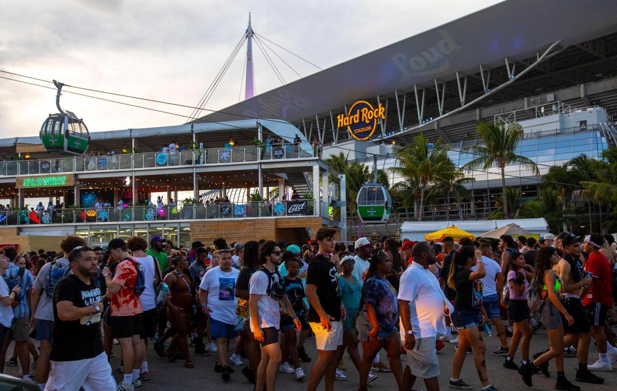 Festival goers walk the grounds during the first day of Rolling Loud Miami, an international hip-hop festival, at Hard Rock Stadium in Miami Gardens, Florida, on Friday, July 22, 2022.