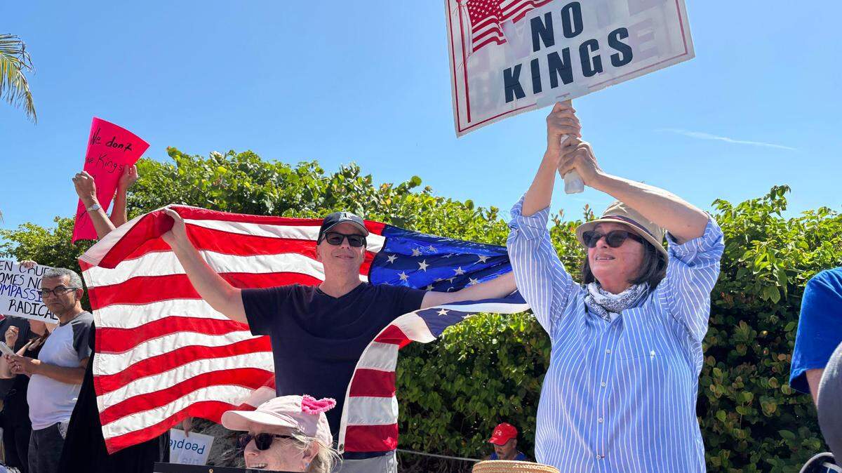 Demonstrators gathered along State Road A1A’s sidewalk on Fort Lauderdale Beach to protest President Donald Trump as part of the “No Kings” protests scheduled across the country on Saturday, June 14, 2025.