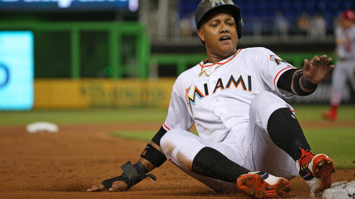 Miami Marlins second baseman Starlin Castro slides safely into third base during a game against St. Louis on Wednesday. Castro has had a good season but hasn’t generated much trade interest because of his salary ($10 million this season, $11 million next season).