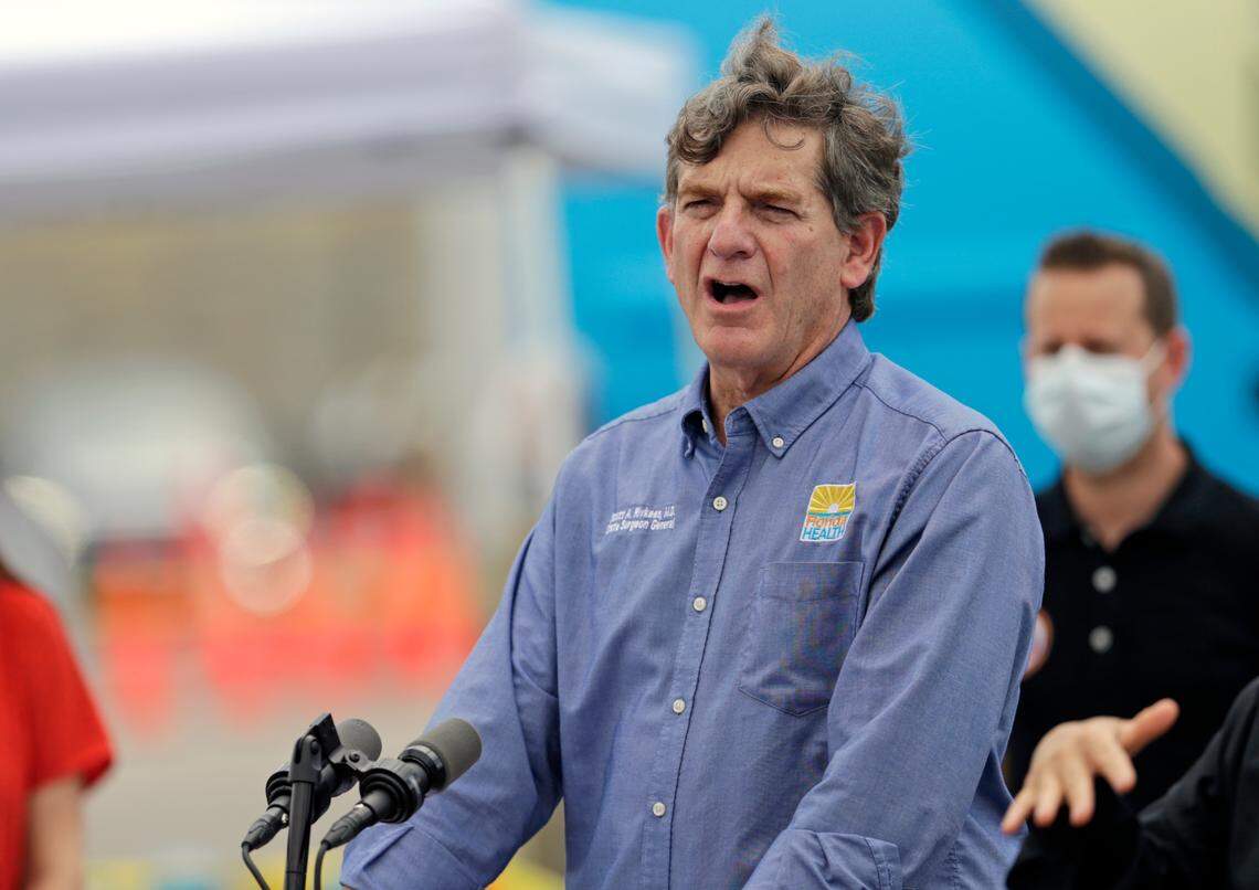 State Surgeon General Dr. Scott Rivkees talks to the media alongside Florida Governor Ron DeSantis during press conference to announces COVID-19 antibody testing, mobile lab at Hard Rock Stadium as the Novel Coronavirus pandemic continues on Wednesday, May 6, 2020 in Miami Gardens.