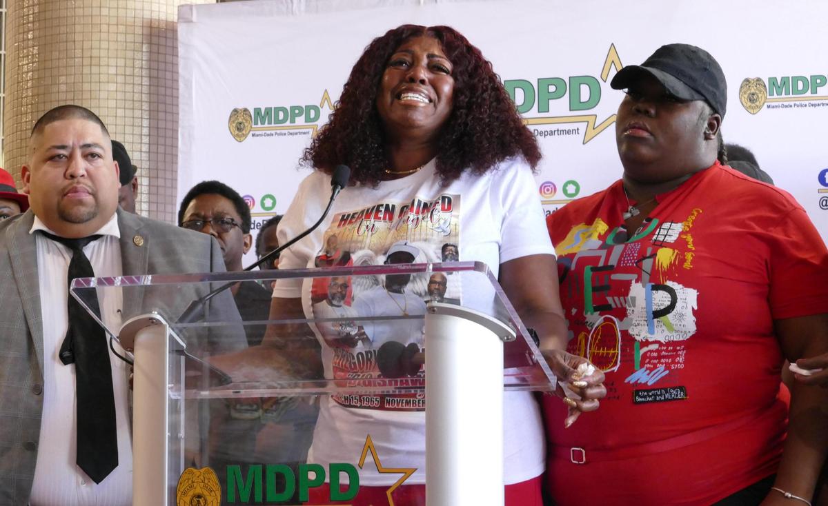 Donna Shaw, widow of Gregory Denard Shaw, 57, speaks with reporters during a news conference at Miami-Dade Police Department’s headquarters in Doral on Tuesday, Nov. 7, 2023. By her, wearing a red T-shirt, is Gregory Shaw’s cousin, Sharraine Fulton.