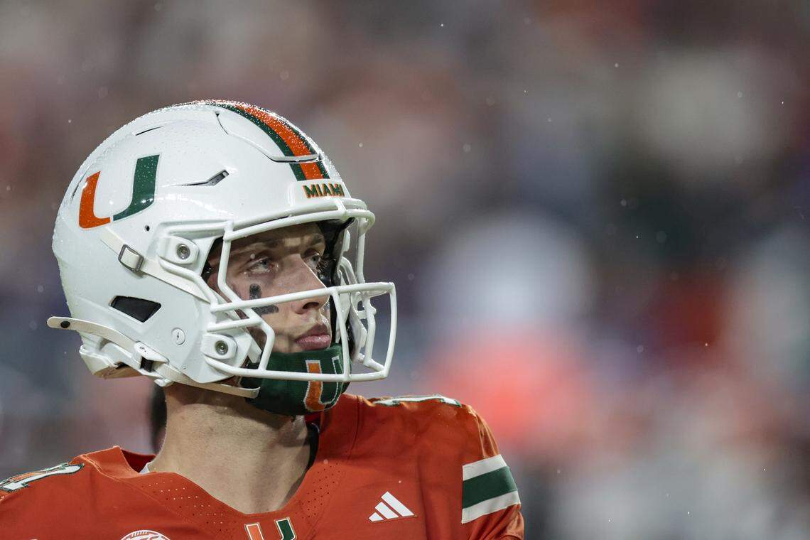 Miami Hurricanes quarterback Carson Beck (11) on the field as it rains during their NCAA football game against the Florida Gators at Hard Rock Stadium in Miami Gardens, Florida, on Saturday, September 20, 2025.