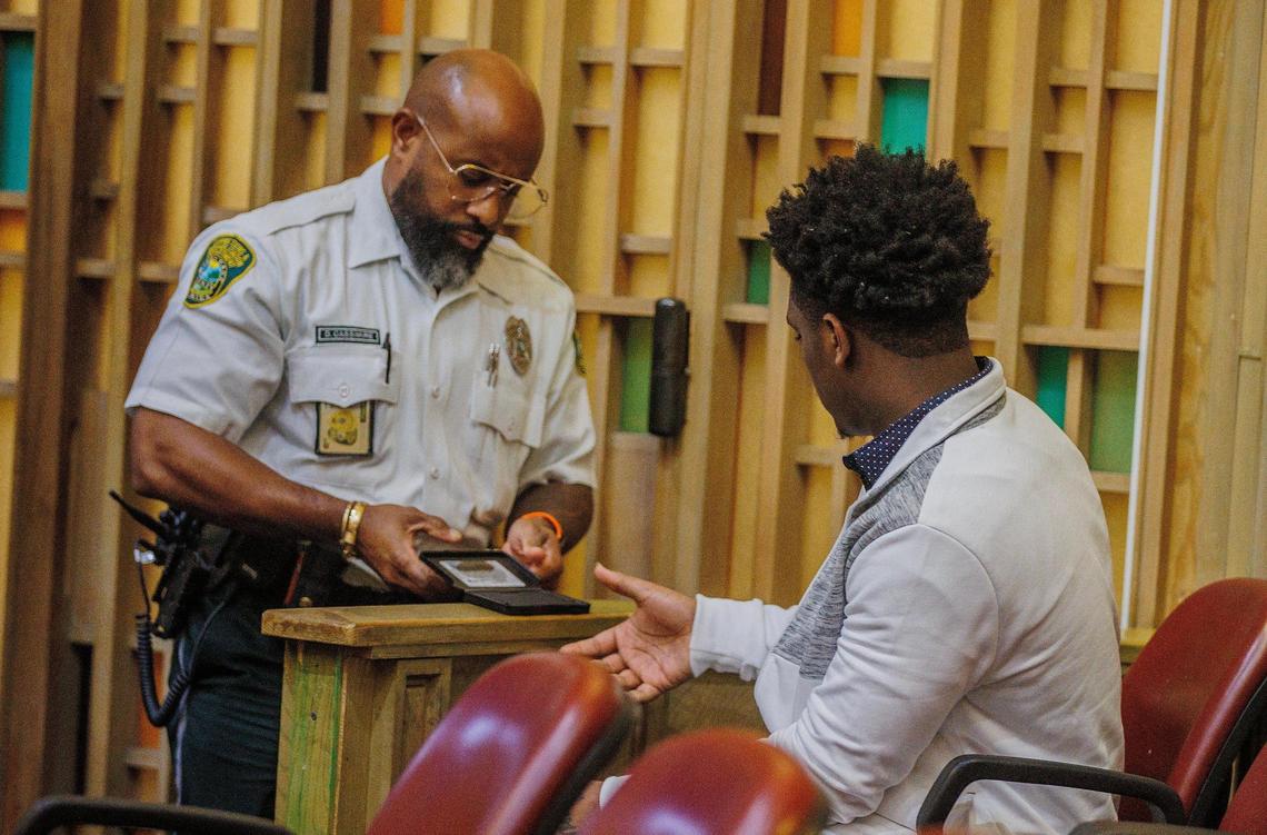 Defendant Davonte Barnes gets finger printed after being found guilty of several counts of second-degree murder and second-degree attempted murder during a mass shooting at a Northwest Miami-Dade banquet hall two years ago. During his trial in front of Judge Marisa Tinkler Mendez. The hearing is taking place at the Gerstein Justice Bldg in Miami on Friday, September 29, 2023.