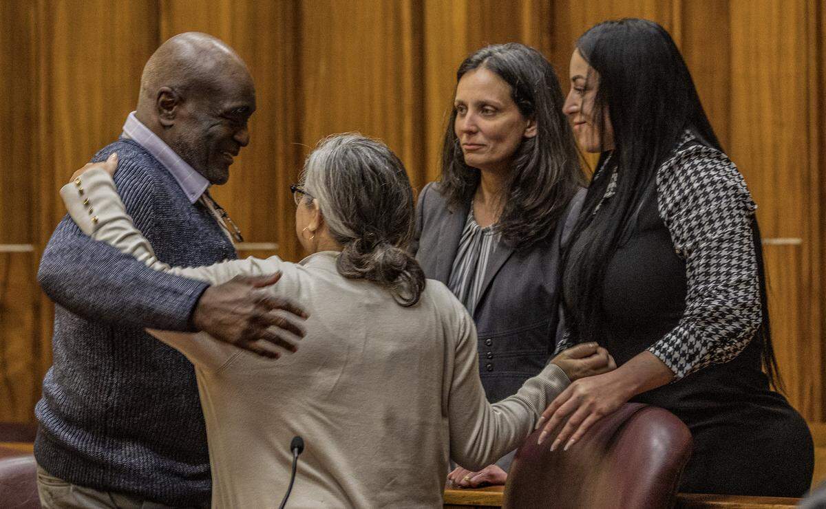 Defense team members embrace Harrel Braddy, convicted of leaving a 5-year-old girl to die in the Everglades in 1998, after he was convicted to life in prison in his death penalty resentencing hearing in Courtroom 4-1 at the Richard E. Gerstein Justice Building, on Friday, January 30, 2026.