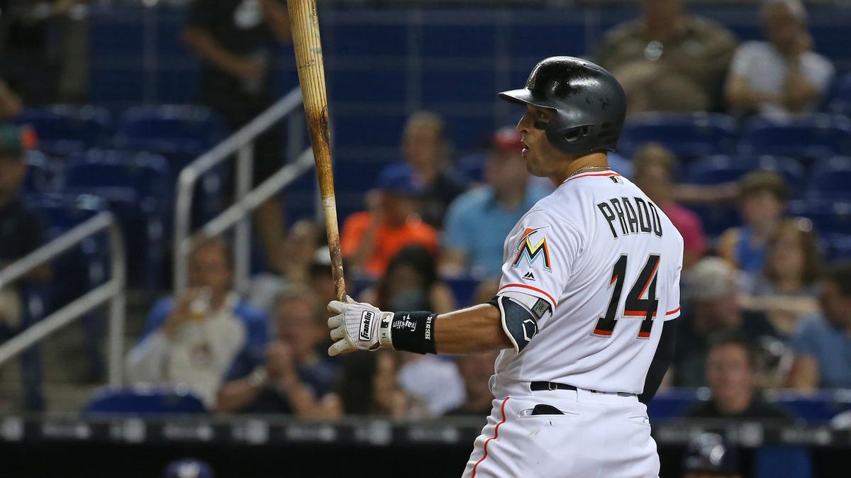 Miami Marlins third baseman Martin Prado bats during the second inning of a Major League Baseball game against the Milwaukee Brewers at Marlins Park on Wednesday, July 11, 2018. The Miami Marlins are the latest to cut ties with Papa John's after the chain's founder and former chief executive officer used a racial slur in describing slow sales.