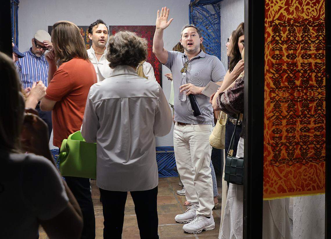 ICA artistic director Alex Gartenfeld, center, waves to other museum cohorts as they assembled at the underground garage for a tour of the Tunnel Projects, a multifaceted art space dedicated to supporting local artists on Saturday, April 11, 2026, in Little Havana, Miami, Florida.
