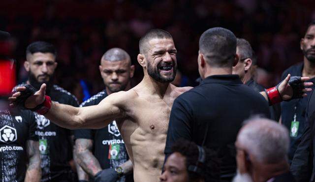 Mateusz Gamrot of Poland prepares to enter the octagon before his lightweight bout against Esteban Ribovics of Argentina at UFC 327 at the Kaseya Center on Saturday, April 11, 2026, in downtown Miami, Fla.