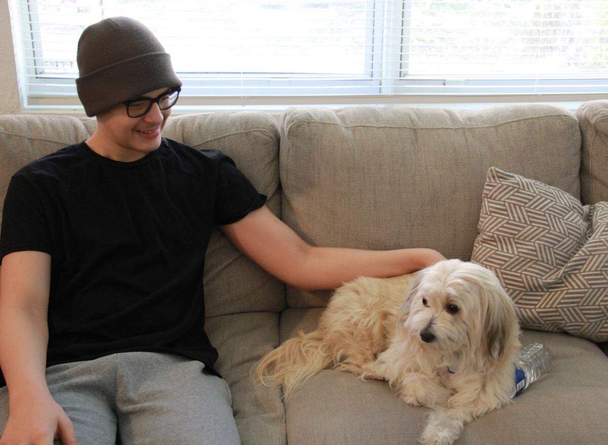 Jordan Gotay and his family dog, Kenya.