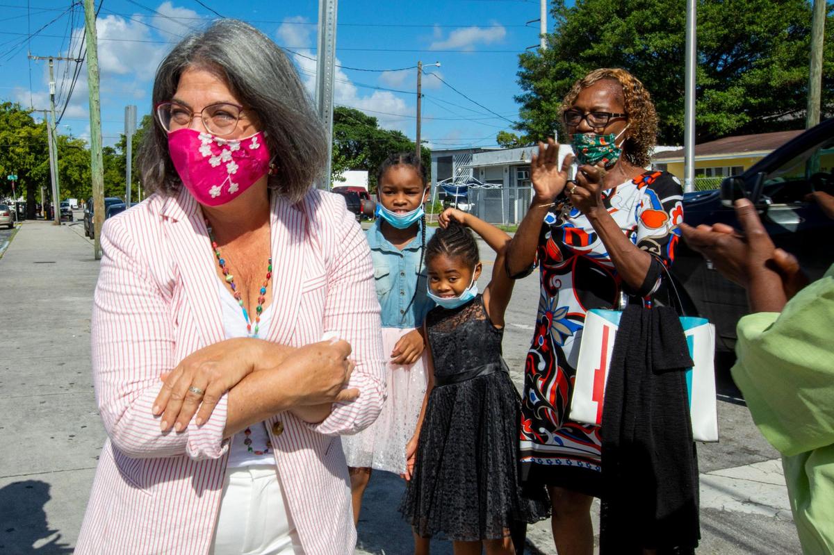 County Mayor-elect Daniella Levine Cava speaks with constituents near a mural designed in her honor as she stops in the Liberty City neighborhood of Miami on a tour of Miami-Dade on Sunday, Nov. 15, 2020. Levine Cava becomes Miami-Dade’s first woman mayor on Tuesday, Nov. 17.
