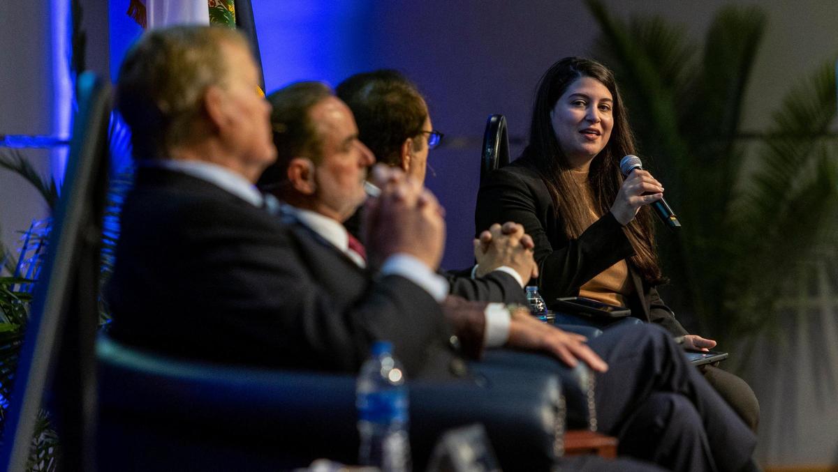 Sofia Trelles, right, speaks during a community listening session on the presidential search held at the FIU Modesto A. Maidique Campus on April 13, 2022.