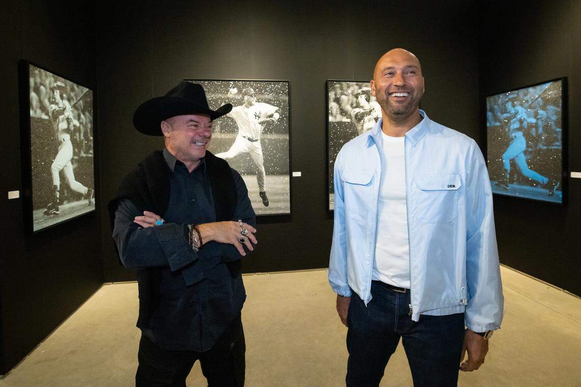 Derek Jeter talks with artist Russell Young during unveiling of his series of artworks called JETER at Art Miami.