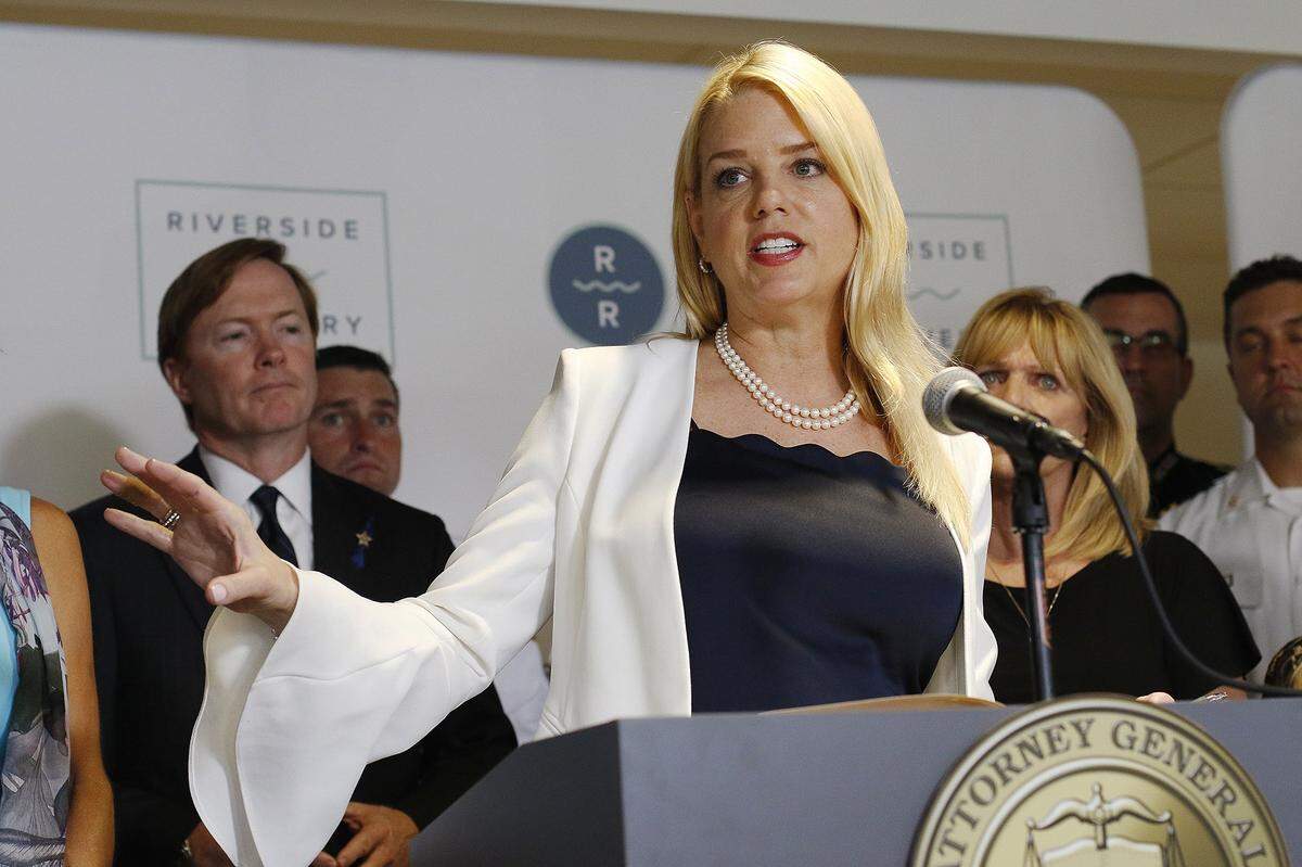 Attorney General Pam Bondi gives a press conference May 15, 2018, in Tampa, announcing that her office has filed a lawsuit against five large drug manufacturers and distributors of opioids.
