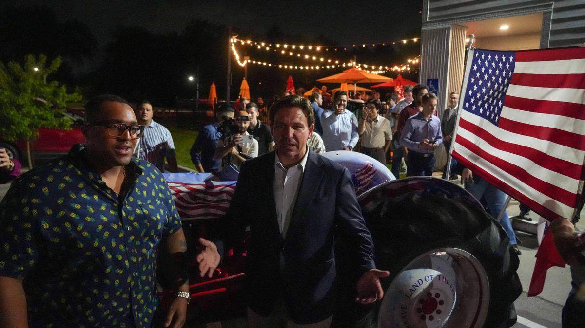 Florida Gov. Ron DeSantis visits with supporters after making an unscheduled visit to the Jethro’s BBQ Southside in Des Moines on Saturday, May 13, 2023.