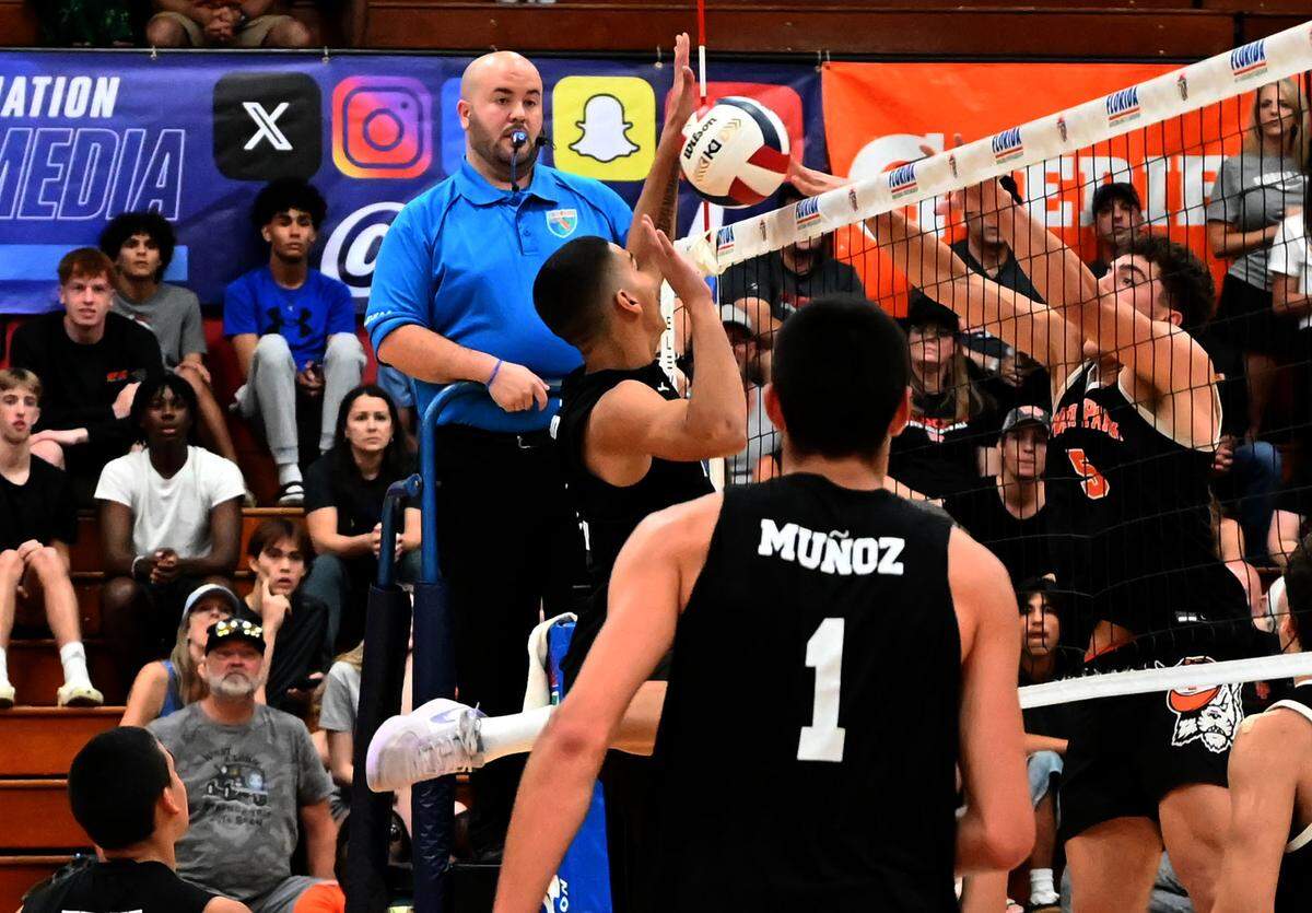 Southwest senior Dereck Ocasio ties up a ball against the Winter Park frontline during the Class 3A boys volleyball state championship game on Saturday at Polk State College in Winter Haven.