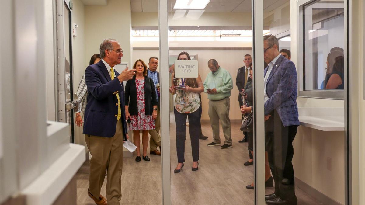 County judge Steven Leifman, left, leads the group through the redesigned receiving area while giving a tour to a group of business and civic leaders of the newly renovated and designed Miami Center for Mental Health and Recovery for inmates on Thursday, August 24, 2023 in Miami, Florida.