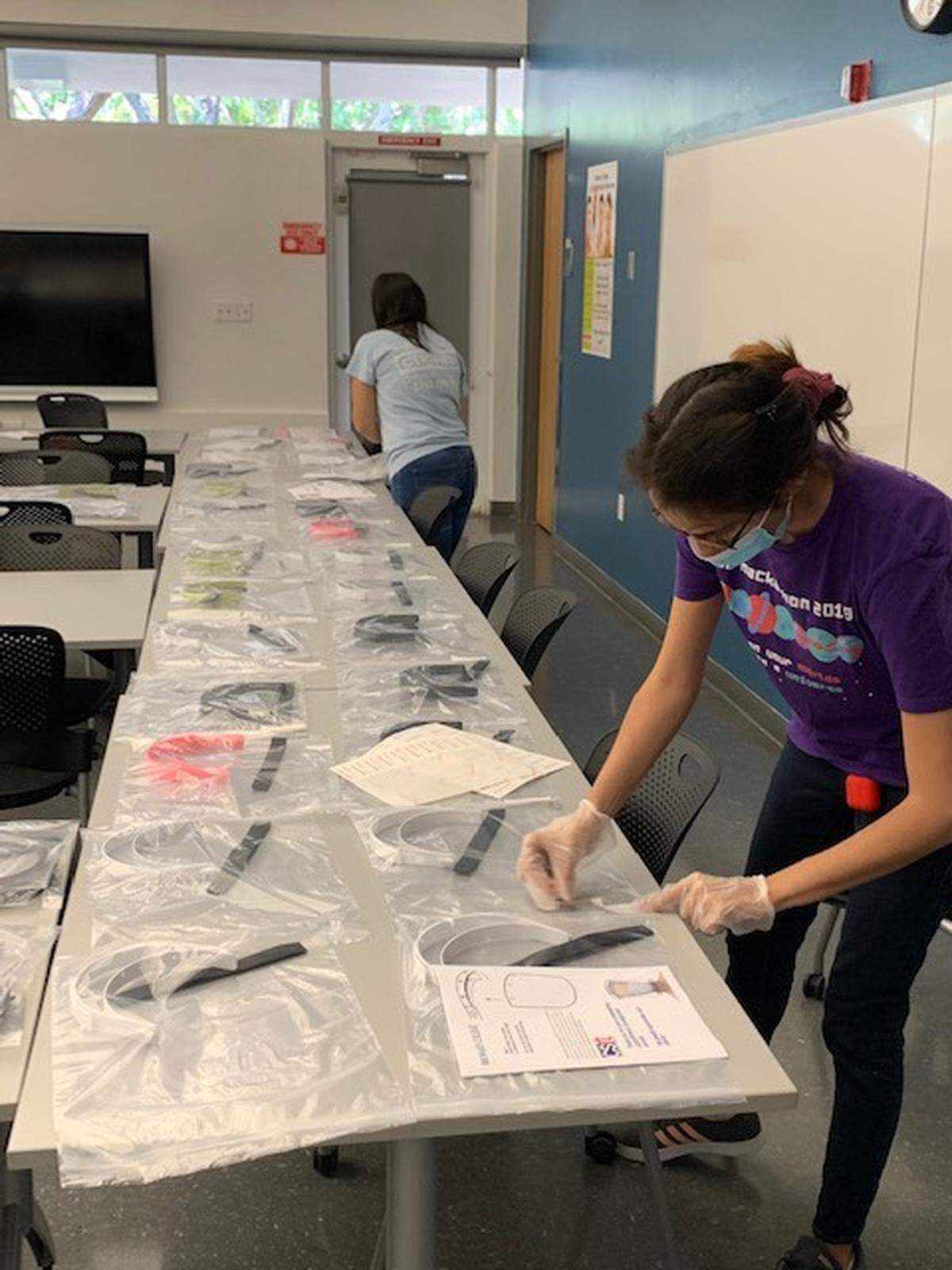 A Broward College student packs all of the parts needed for a 3D-printed face shield destined for healthcare workers tending to COVID-19 patients in South Florida.