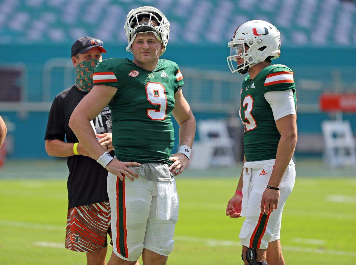 Miami Hurricanes Quarterback Tyler Van Dyke (9) and quarterback Jake Garcia (13) look on during spring game at Hard Rock Stadium in Miami Gardens on Saturday, April 17, 2021.