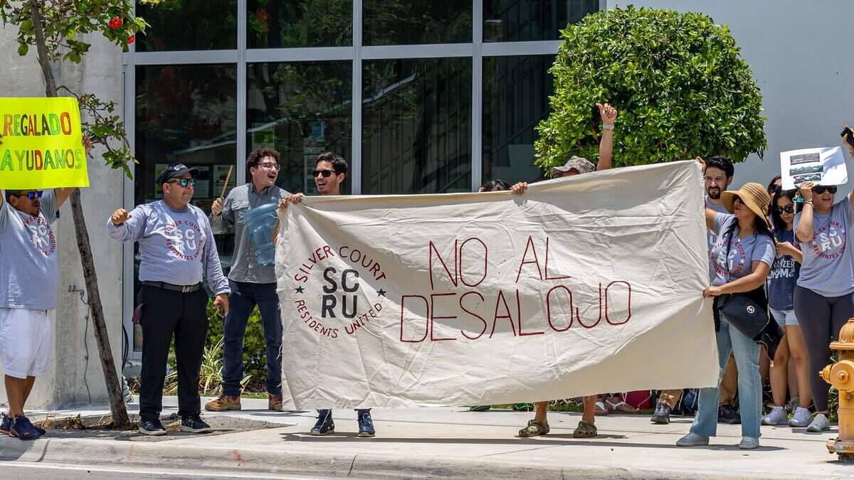 Protesters gather on the street in front of County Commissioner Raquel Regalado’s office in Miami on Wednesday, July 1, 2026. Residents and supporters urged the county to intervene or help secure more time for approximately 200 families facing displacement ahead of a September deadline to vacate Silver Court trailer park.