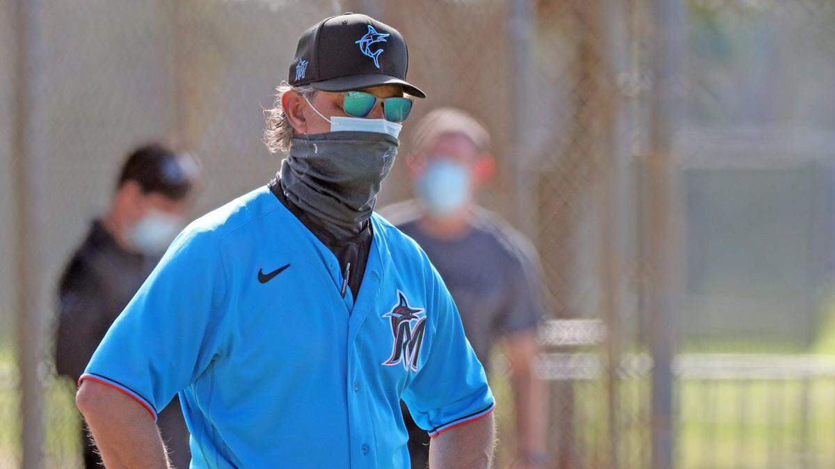 Miami Marlins manager Don Mattingly watches players on the practice field during spring training at the Roger Dean Chevrolet Stadium in Jupiter on Tuesday, February 23, 2021.