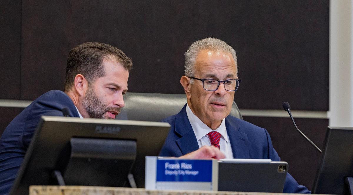 City of Doral Manager Rey Valdez (right) talks with Francisco J. Rios, deputy city manager, during a meeting to discuss the budget for years 2024-2025, on Tuesday, Sept. 17, 2024.