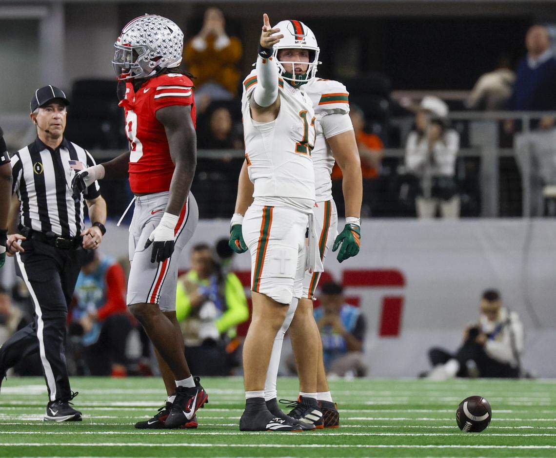 Miami Hurricanes quarterback Carson Beck (11) signals a first down after running with the ball against the Ohio State Buckeyes during the second half of the College Football Playoff quarterfinal game in the Cotton Bowl at AT&T Stadium in Arlington, Texas on Wednesday, December 31, 2025.