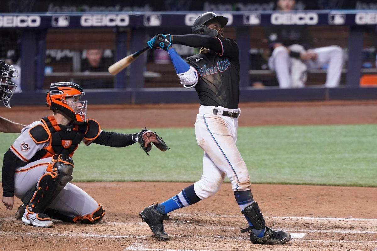 Miami Marlins’ Jazz Chisholm Jr. hits a home run during the fifth inning of a baseball game against the San Francisco Giants, Friday, April 16, 2021, in Miami. (AP Photo/Marta Lavandier)