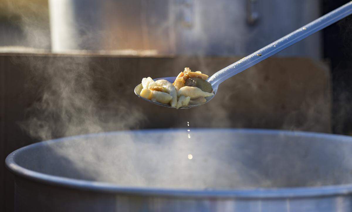 Sophia Collins, working with Kravinz, prepares goat soup for sale at the Reggae Genealogy music festival at Volunteer Park on Saturday, Feb. 7, 2026, in Plantation, Fla.