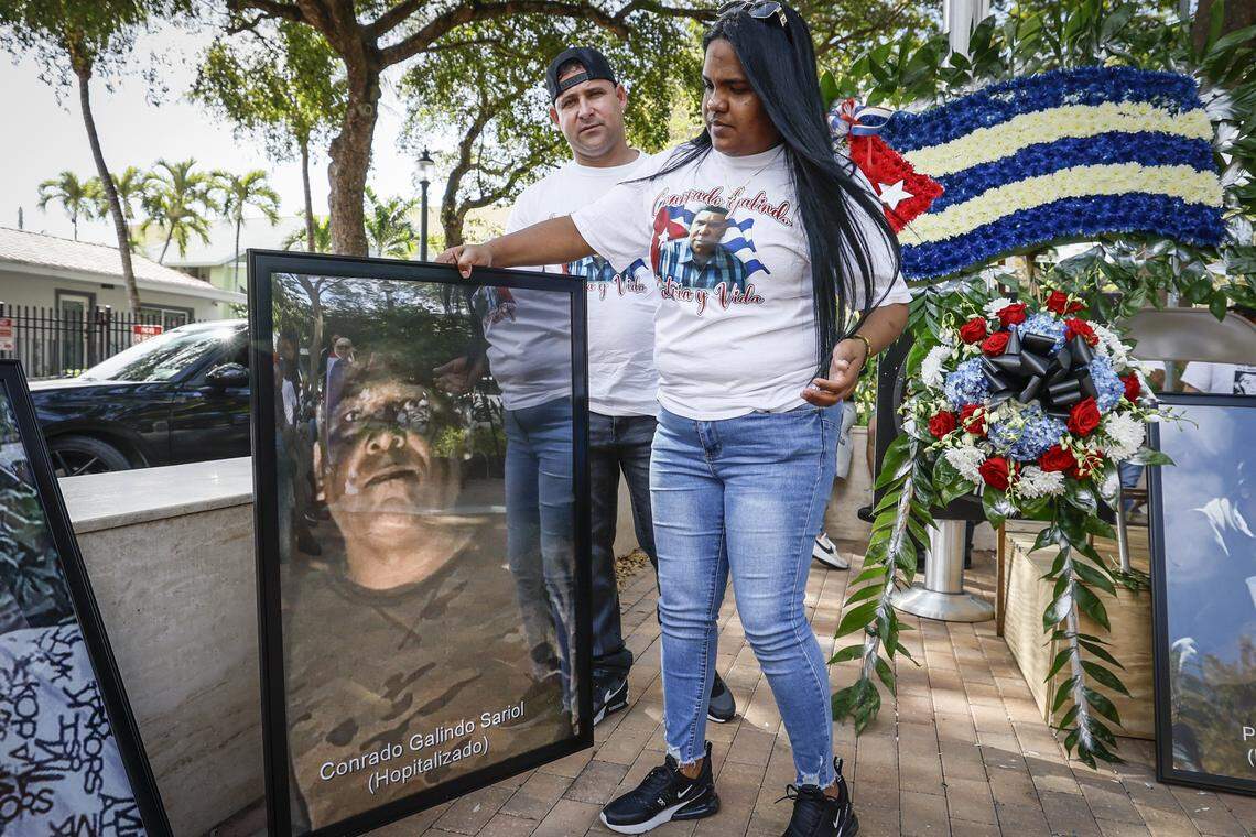 Ana Segui holds an enlarged photograph of her husband Conrado Galindo Sariol, who is detained in Cuba, during a Proof of Life of Our Brothers ceremony at the Bay of Pigs Monument in the Little Havana area of Miami, Florida, on Sunday, March 8, 2026. Cuban dissident groups held a press conference to demand repatriation of the bodies of the men killed in the shootout with the Cuban Coast Guard on Sunday, March 8, 2026. They also demanded that the U.S. citizens involved in the incident be allowed to speak to U.S. diplomatic employees.