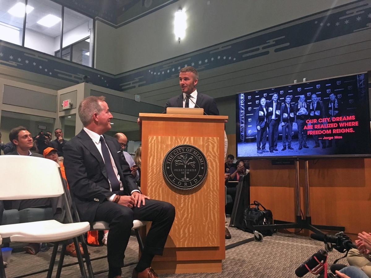 David Beckham addresses the Miami City Commission on Thursday, July 12, 2018, as Jorge Mas looks on.