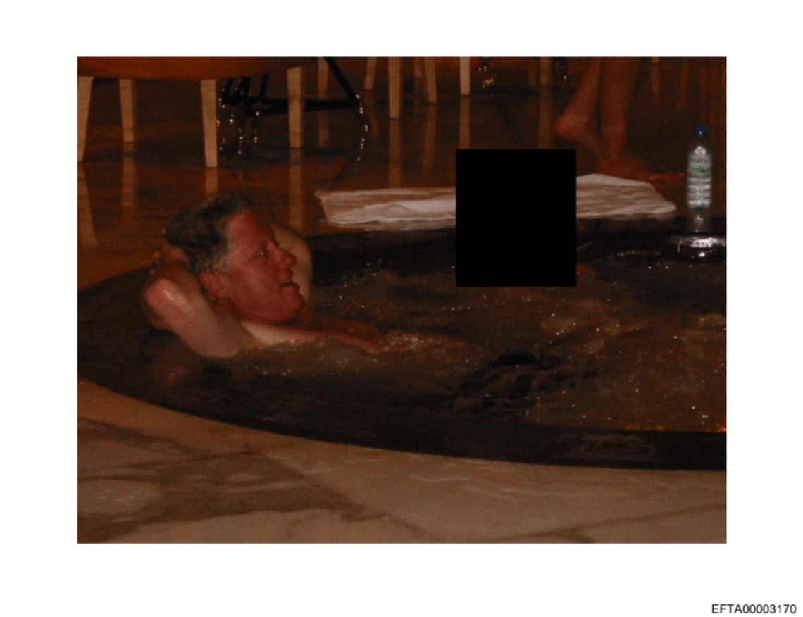 An undated photo released by the Department of Justice as part of the Epstein files shows former President Bill Clinton in a pool with a figure whose face has been blacked out.