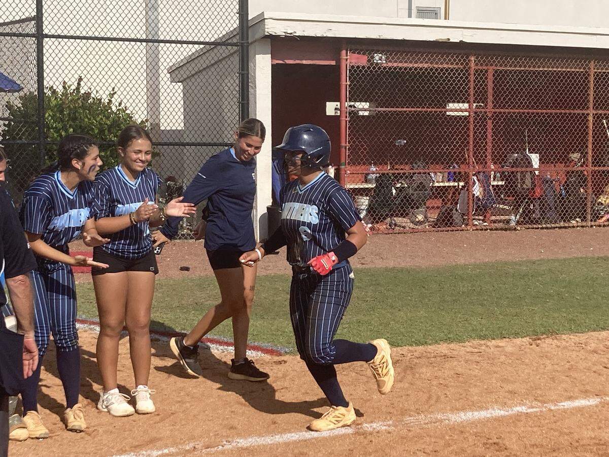 Coral Springs Charter’s Jazzy Chung is welcomed at the plate after hitting a home run on Thursday in the Panthers’ 3-0 regional final win over host Cardinal Gibbons in Fort Lauderdale, Fla.